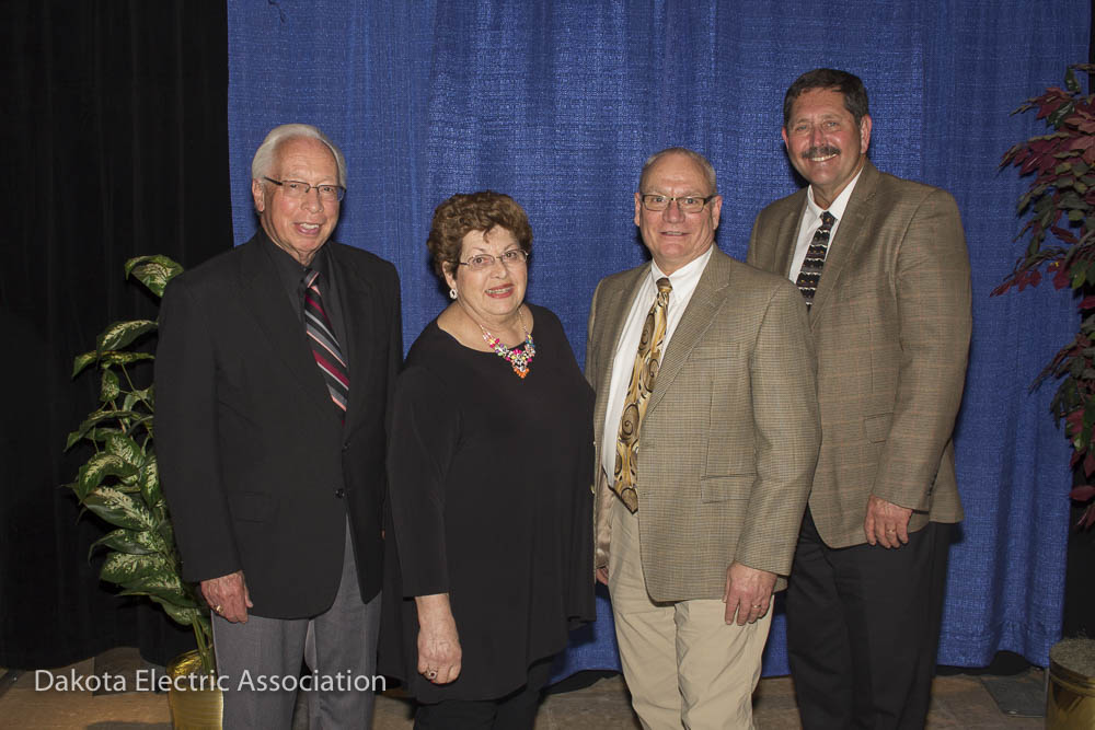Four re-elected directors standing together.